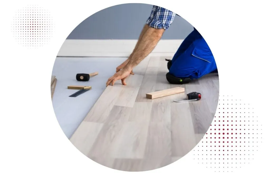 a man installing hardwood floor