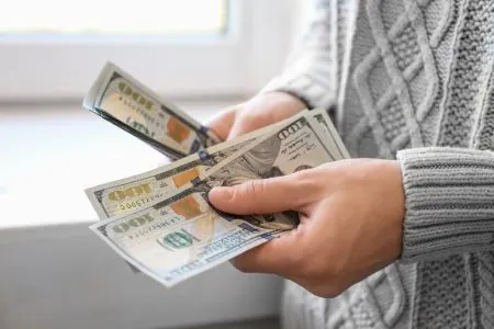 a woman counting money